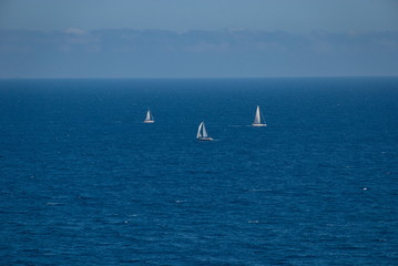 Barcelona, Spain - 18.08.2019: Beautiful white sailing yacht in the blue huge sea