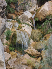 Obraz premium Cascades of the Guadalquivir River as it passes through Cerrada de Utrero in the Natural Park of the Sierra de Cazorla, Segura and Las Villas. In Jaén, Andalusia. Spain