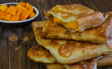 Pumpkin pie on a wooden tray