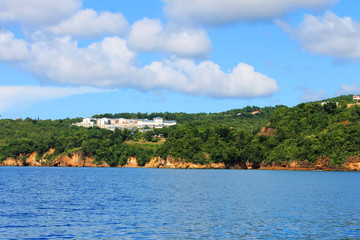 Looking from a boat at the houses and buildings on the shore and hills, St. Lucia, West Indies
