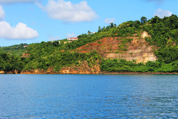 Looking from a boat at the houses and buildings on the shore and hills, St. Lucia, West Indies