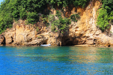 Caves in the cliffs along the shoreline, St. Lucia, West Indies