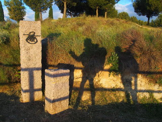 Male and Female shadow on the road to Santiago de Compostela, Camino de Santiago, Way of St. James,...