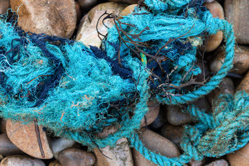 Tangled fishing nets and ropes on the beach