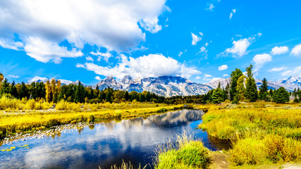 Fototapeta na wymiar Reflections of the Grand Tetons Peaks in the waters of the Snake River at Schwabacher Landing in Grand Tetons National Park, Wyoming, United States