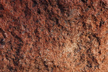 brown stone wall texture from a piece of dirty granite
