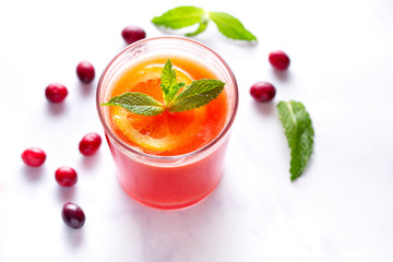 Fresh Homemade Cranberry Orange Juice with Mint Garnish