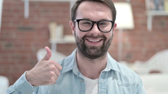 Portrait of Successful Beard Young Man showing Thumbs Up
