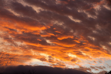 Orang purple sunset over mountains.