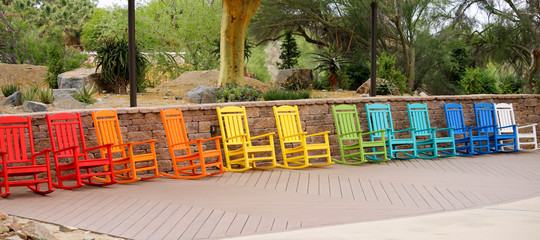 Panorama of a row of beautiful colorful chairs