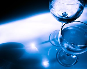 glass of water on blue background