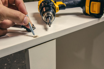 Assembly of hard furniture, close-up drawers for drawers