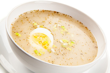  Sour rye soup on white background