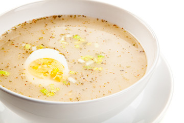  Sour rye soup on white background