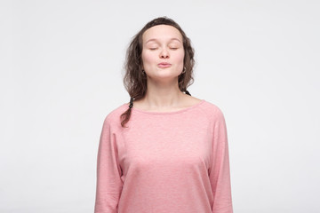 Tender european woman waiting for kiss with closed eyes. Girl waits till boyfriend will kiss her
