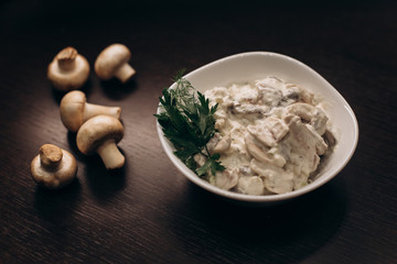 Mushrooms Salad with yogurt on the table