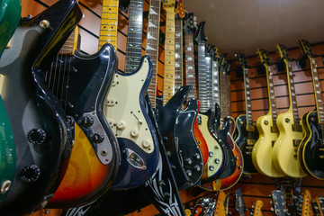 Fototapeta na wymiar Guitars in store for sale