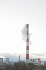Pollution of the environment, with the pipe smoke in the background of clear sky