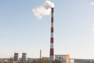 Obraz premium Pollution of the environment, with the pipe smoke in the background of clear sky