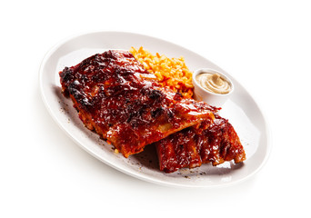 Barbecued ribs and vegetables on white background
