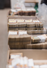 Banknotes with bill bands in carton boxes at the treasury department