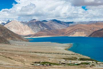 Ladakh, India - Aug 08 2019 - Pangong Lake view from Spangmik Village in Ladakh, Jammu and Kashmir, India. The Lake is an endorheic lake in the Himalayas situated at a height of about 4350m.