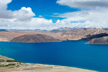 Ladakh, India - Aug 08 2019 - Pangong Lake view from Spangmik Village in Ladakh, Jammu and Kashmir, India. The Lake is an endorheic lake in the Himalayas situated at a height of about 4350m.