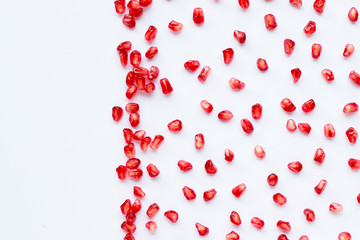 Pomegranate seeds isolated on white background.