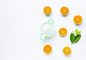 Citrus orange juicer with oranges fruit on white