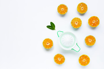 Citrus orange juicer with oranges fruit on white