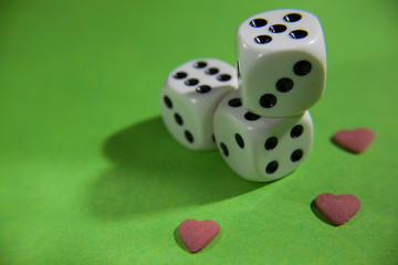 white cubes and small hearts on a green screen