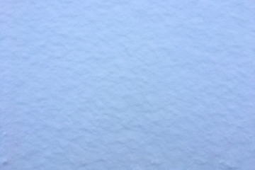 Snow background textured blue. Texture natural snowing cover. 