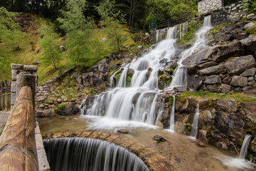 A small cascade waterfall, near a village of Encamp, Andorra. Located in the Pyrenees mountain