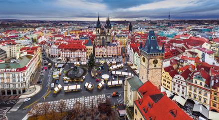 Prague, Czech Republic - Aerial high resolution panoramic view of the Old Town Square at Christmas time with Old Town Hall tower, Church of our Lady before Tyn, red rooftops and Christmas market