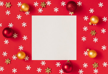 Fototapeta na wymiar Christmas mockup with snowflakes and gold and red balls on a red background. Happy new year. Space for text. Winter concept.
