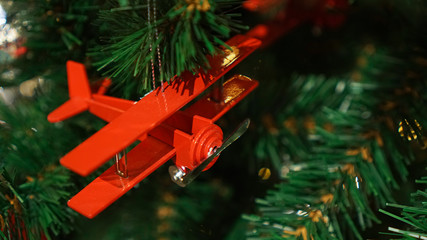 Christmas decorations on the tree. Airplane.