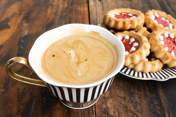 Coffee with Biscuits on a Rustic Wooden Background