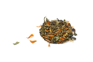Small heap of dry healthy herbal tea with petals of medicinal plants on a white background