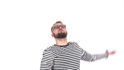 A funny awkward hipster guy trying to catch a fly with hands. White background.