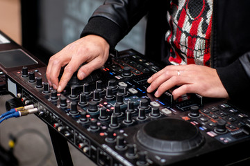 DJ CD player and mixer. DJ Spinning, Mixing, and Scratching, close up