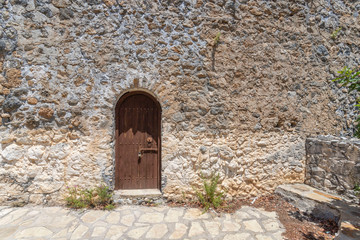 Fototapeta na wymiar ancient door to the castle of St. Hilarion, Kyrenia mountain range, Cyprus