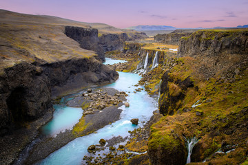 Beautiful landscape of Sigoldugljufur canyon with many small waterfalls and the blue river in Highlands of Iceland