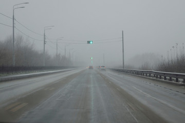 Snowy winter road during blizzard. Heavy snow storm.