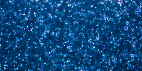Obraz premium Sparkling classic blue texture background. Color of the year 2020