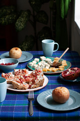 A nutritious and tasty breakfast for two: baked apples, baguette slices with smoky salmon.