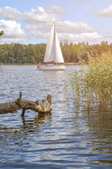 Blue lake and yacht. Europe, spring.