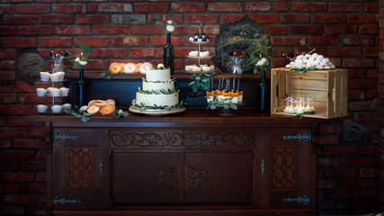 Decorated wedding tables with numbers on bottles and beautiful rose compositions on the tables