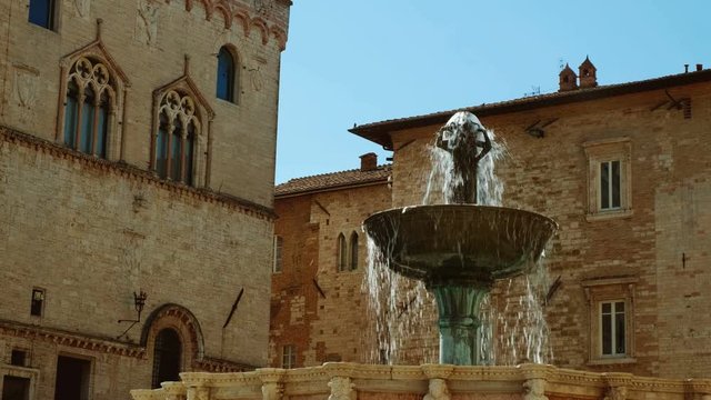 Slow motion shot of the Fontana Maggiore, a monumental medieval fountain located in the historic center of Perugia, Umbria, Italy