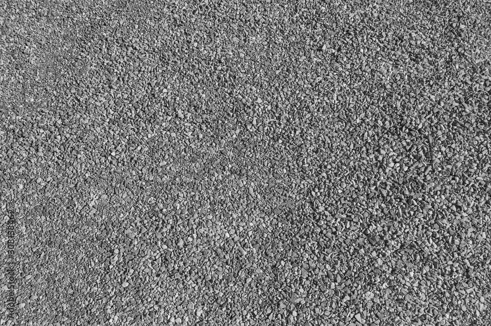 Wall mural fine gravel used to cover tracks. great background for any use. black and white image.