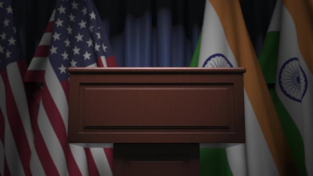 Row of flags of India and the USA and and speaker tribune, conceptual 3D animation